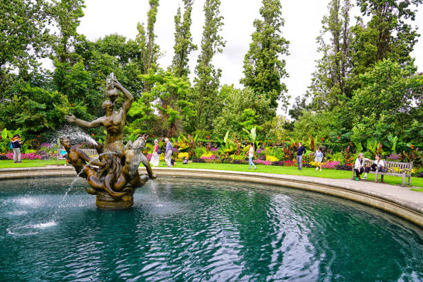 Telephoto image of the Triton fountain at the centre of a roundabout.