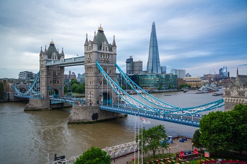 London, United Kingdom – July 18, 2022: The Tower Bridge in London, England, against a backdrop of the city skyline