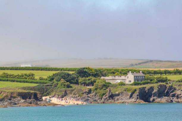 istock Fog over the mainland at Harlyn Bay, Cornwall, UK 1612719136