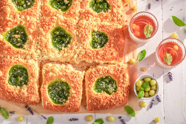 istock Homemade gooseberry yeast cake served with red lemonade. 1612726076