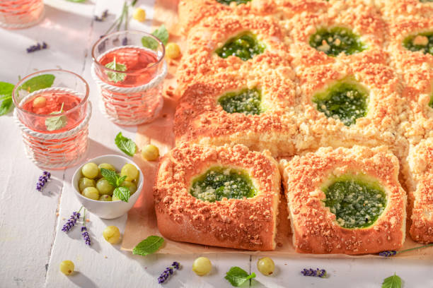 istock Tasty gooseberry yeast cake served with red lemonade. 1612727087