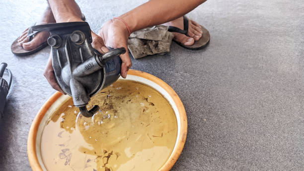 istock A man's hand holding and draining a diesel car filter 1612807215