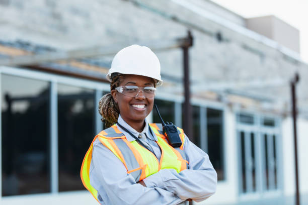 Woman construction worker at strip mall being renovated
