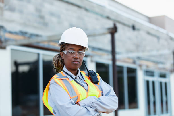 istock Woman construction worker at strip mall being renovated 1612926015