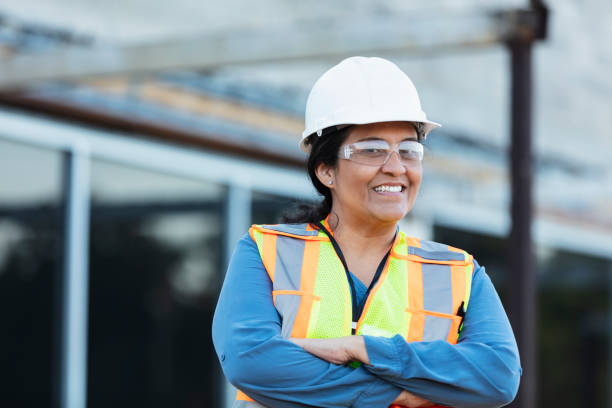istock Hispanic female construction worker at renovation site 1612926023