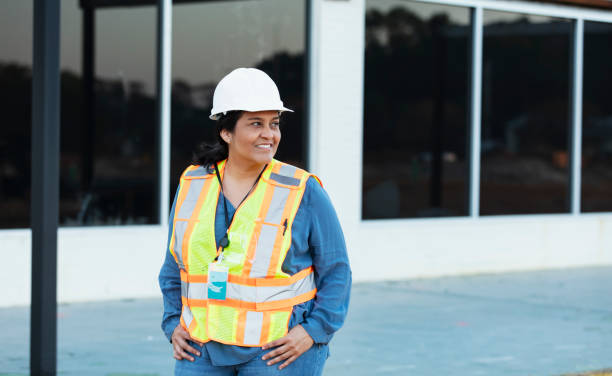 istock Hispanic female construction worker at renovation site 1612926025