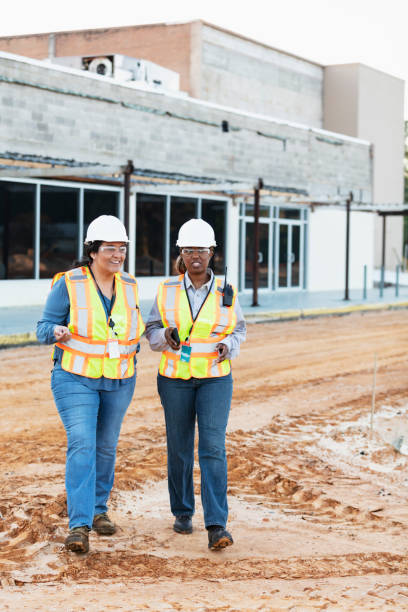 istock Two multiracial female construction workers at job site 1612926555