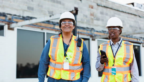 istock Two multiracial female construction workers at job site 1612926558