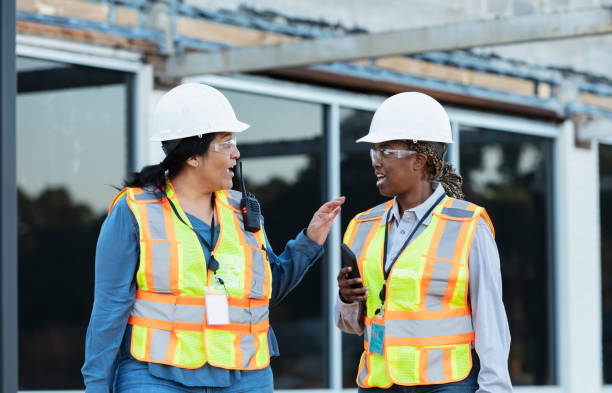 istock Two multiracial female construction workers at job site 1612926559