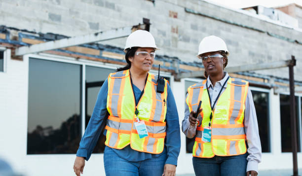 istock Two multiracial female construction workers at job site 1612926563