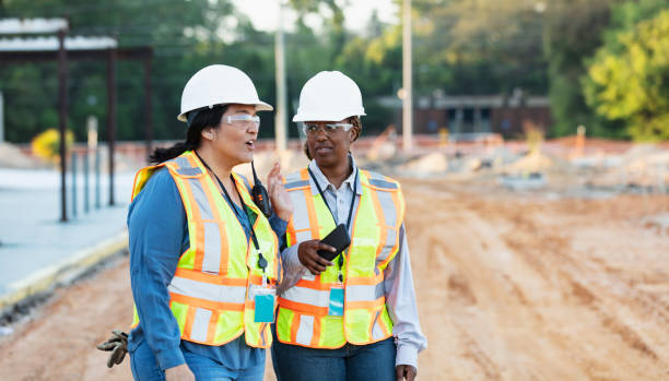istock Two multiracial female construction workers at job site 1612926569