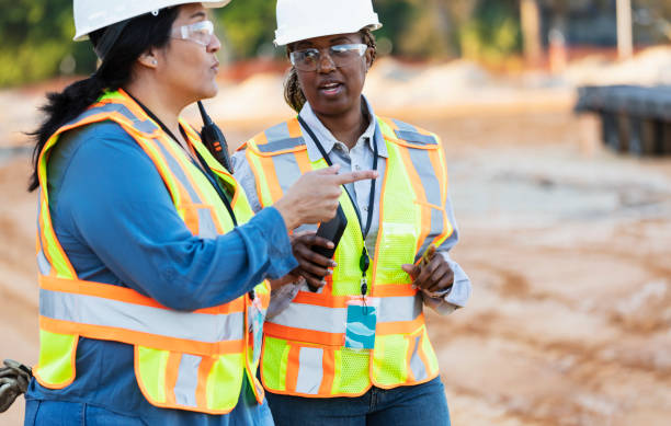 istock Two multiracial female construction workers at job site 1612926571