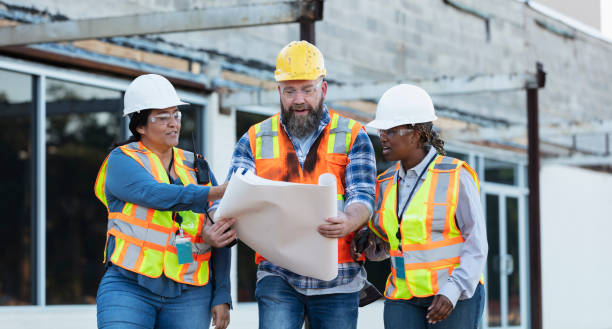 istock Diverse team of three construction workers at job site 1612926572