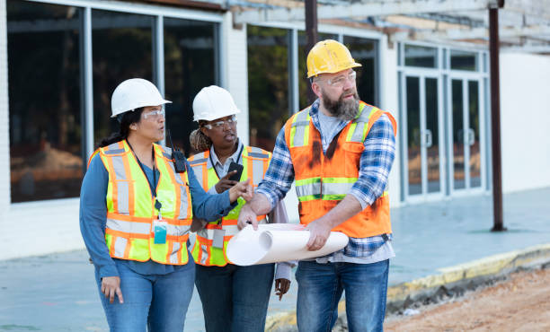 istock Diverse team of three construction workers at job site 1612926576