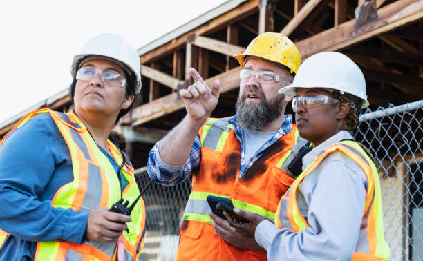istock Multiracial group of workers meeting at construction site 1612927415