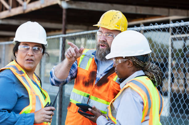 istock Multiracial group of workers meeting at construction site 1612927440