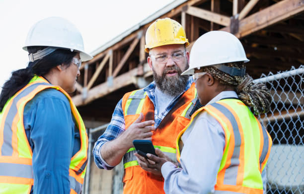 istock Multiracial group of workers meeting at construction site 1612927578