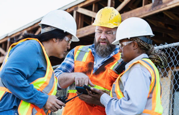 istock Multiracial group of workers meeting at construction site 1612927629
