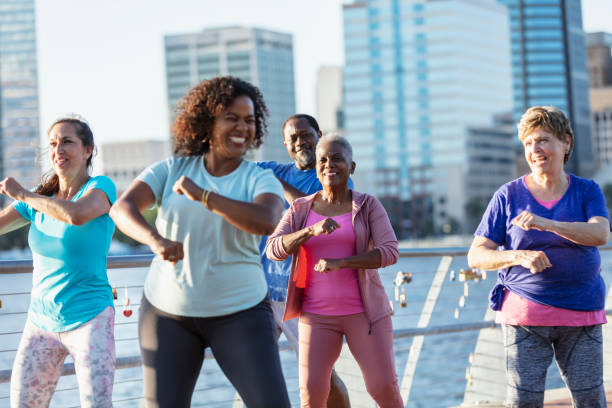 istock Mature and senior adults dancing on city waterfront 1612950928