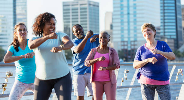 istock Mature and senior adults dancing on city waterfront 1612950930