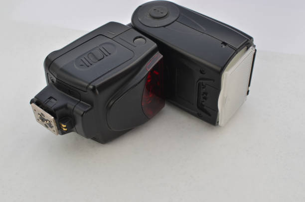 istock Professional black photo flash to provide perfect lighting in any environment. Ideal for projects related to photography and lighting. Providing intense, controlled light for amazing photographs. 1612988031