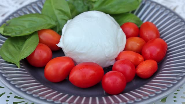 Caprese dish, tomato mozzarella basil
