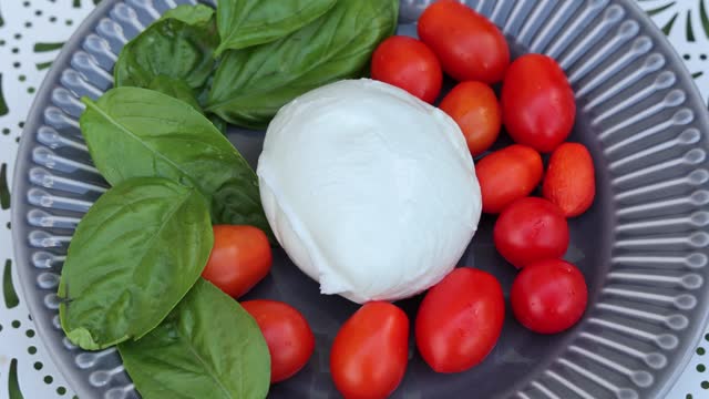 Caprese dish, tomato mozzarella basil