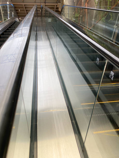 istock escalator handrail. escalator stairs in the mall 1613022979