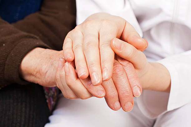 istock Young doctor holds the elderly woman hands 161308861
