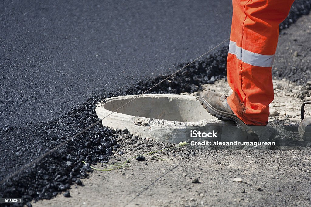 Nuovo strato di asfalto - Foto stock royalty-free di Stivali da lavoro