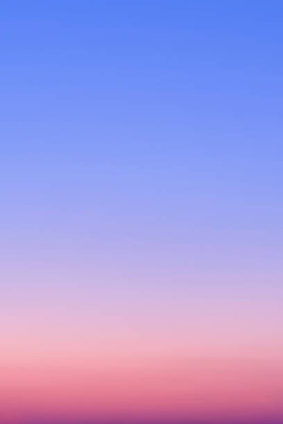 istock Red-blue gradient of clear cloudless sky during sunrise 1613138630