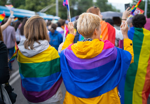 istock LGBTQI supporters wearing flags during pride event 1613144402