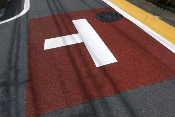 istock Road markings and manhole 1613192145
