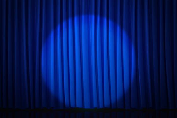 3D blue curtains reminiscent of a movie theater or stage with spotlight background Spotlight background with blue curtain reminiscent of a movie theater or stage that can be used to draw attention. royal blue curtains stock pictures, royalty-free photos & images