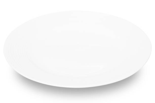 istock White circle ceramics plate isolated on white background. 1613202828