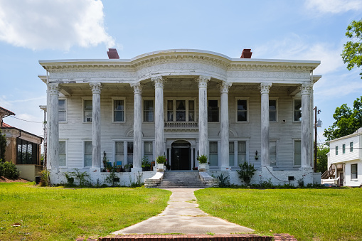 Macon, Georgia USA - June 16, 2023: Beautiful vintage colonial style home on College Street located in this small southern town