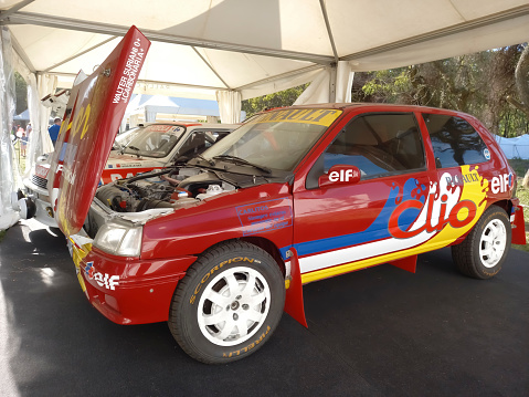 San Isidro, Argentina - Oct 7, 2022: Old red rally racer 1997 Renault Clio Williams. Open hood. Elf sponsorship. Autoclasica 2022 classic car show