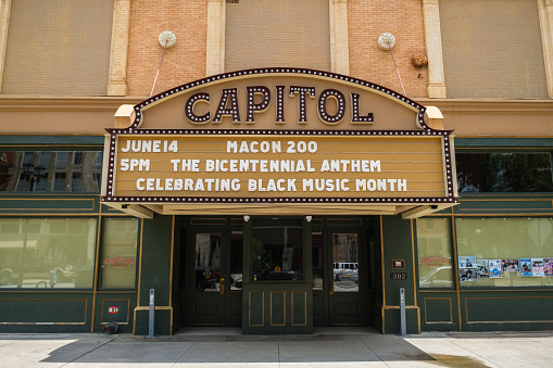 Macon, Georgia USA - June 16, 2023: Cityscape scene with vintage Capitol theatre architecture in the historic downtown district