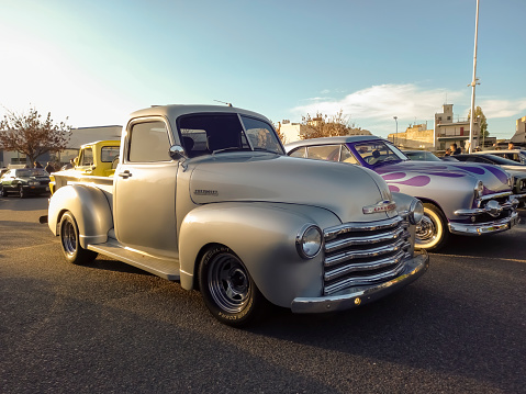 Buenos Aires, Argentina - May 28, 2023: Shot of an old gray 1947 Chevrolet Loadmaster pickup truck Advance Design hot rod in a parking lot. Classic car show