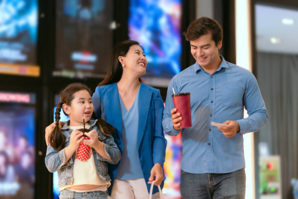 istock Families are using movie tickets to check and chat before going in. 1613216687