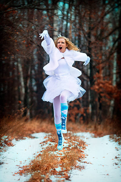 Strange happy jumping bride - Princess in the Forest stock photo