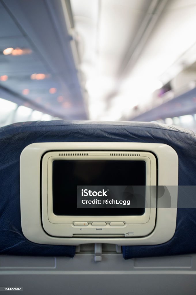 Airline Entertainment Screen A blank screened seat back entertainment device on a commercial airline jet with copy space. Airplane Stock Photo