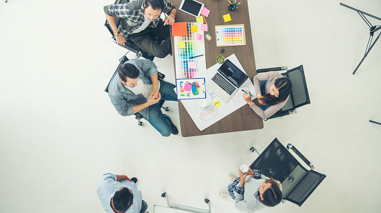 Top view business people meeting together at office desk in conference room. Team business meeting partnership planning brainstorming together. Team Collaborate group of partner company brainstorming