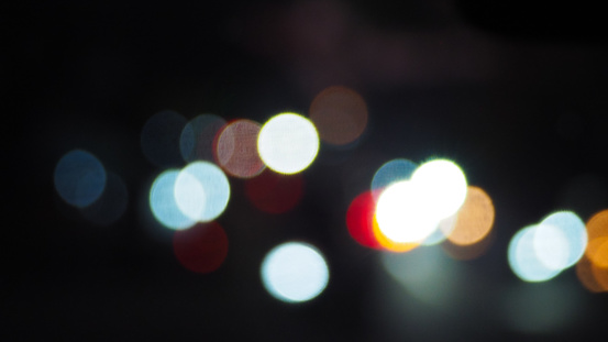 Car headlights blur taken at night on a busy street, Jakarta Indonesia