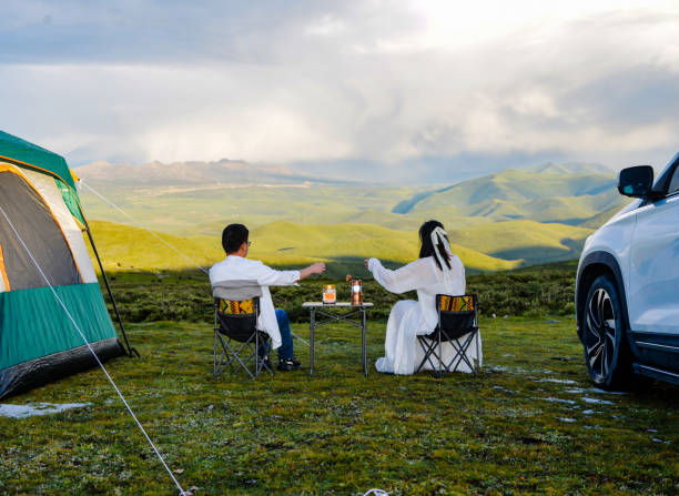 A couple is camping outdoors