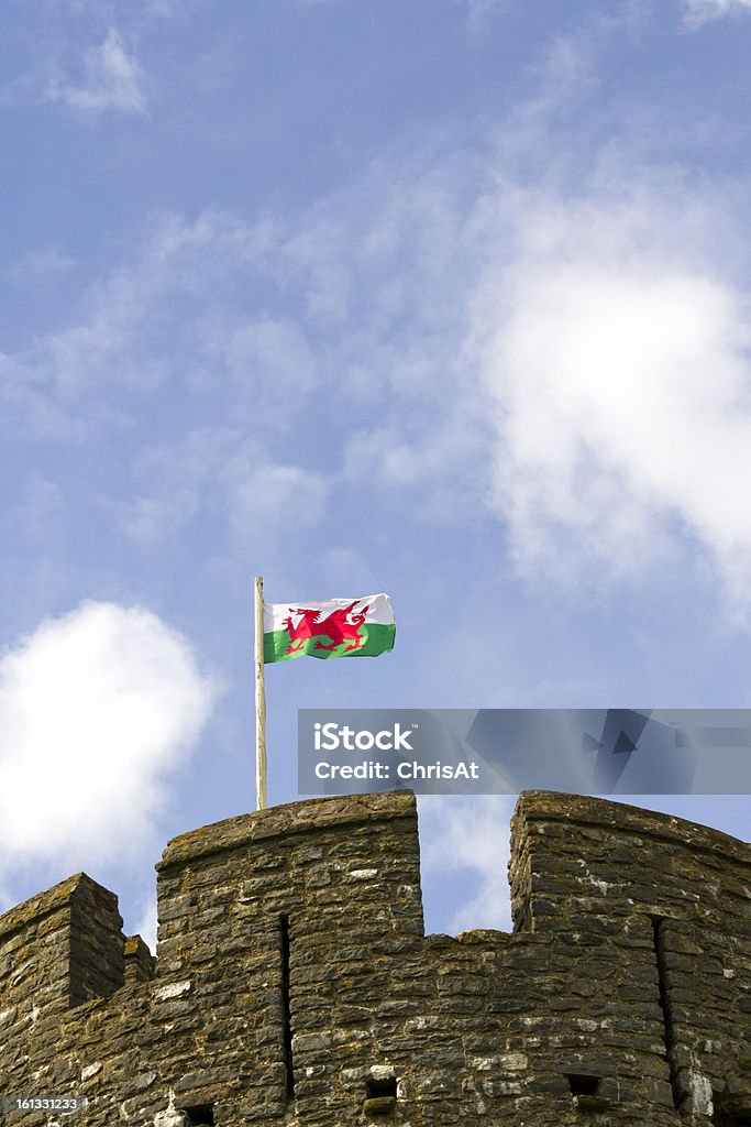 Welsh Flag The Red Dragon, the flag of Wales, UK, flying above battlements Welsh Flag Stock Photo