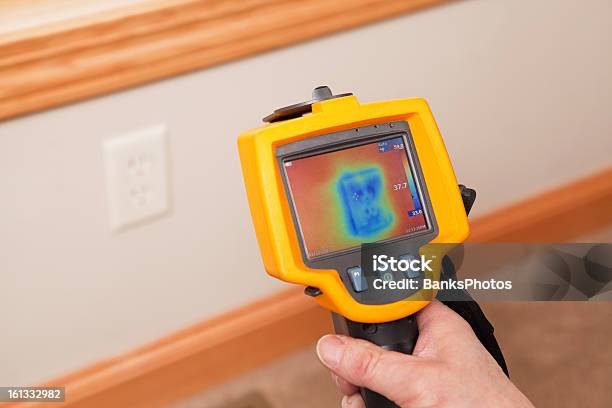 Infrared Thermal Imaging Camera Pointing To Wall Outlet Stock Photo - Download Image Now