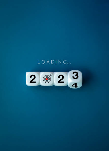 istock Loading to Merry christmas and happy new year 2024 banner background. Loading, text appears on white flipping blocks with 2023 change to 2024 year numbers on blue background, vertical, minimal style. 1613350380
