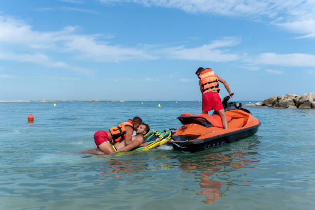 istock Lifeguards rescue a man in the sea using a jet ski 1613369355