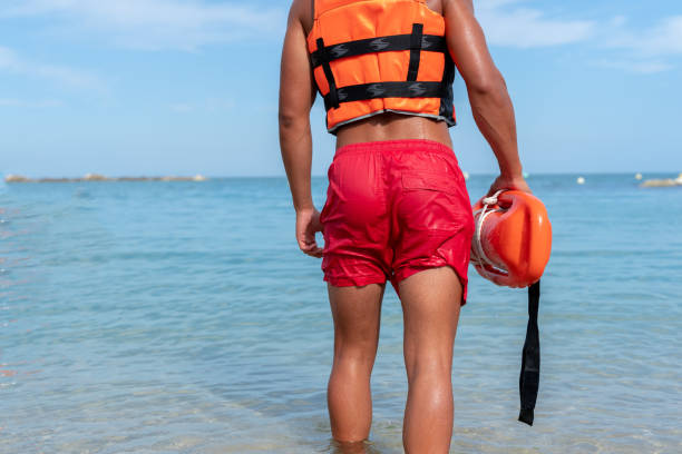 istock Rear view of a lifeguard with float 1613369880
